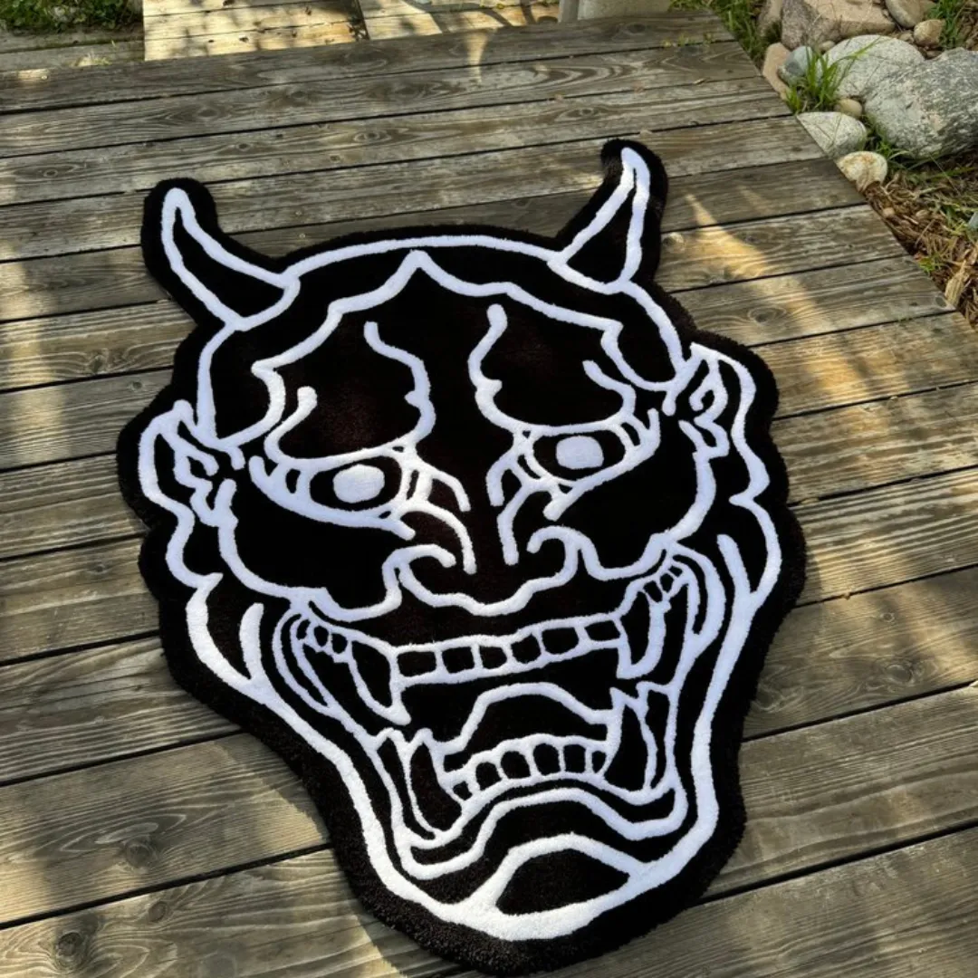 Black Hannya Mask Rug with white outline design on wooden floor