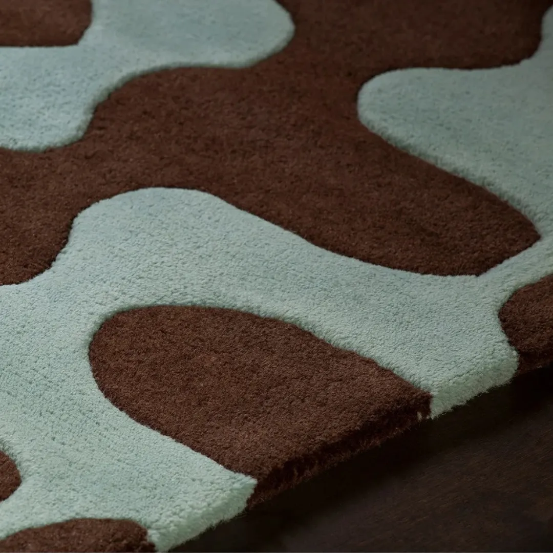 Contemporary area rug with brown and blue organic waves