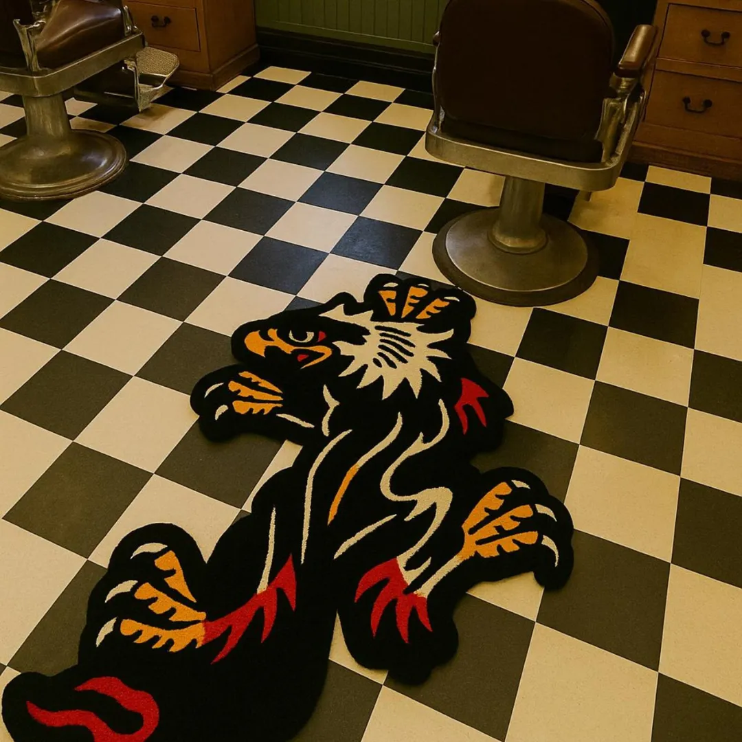 Crawling eagle rug with red, yellow, and purple bird design on a black background