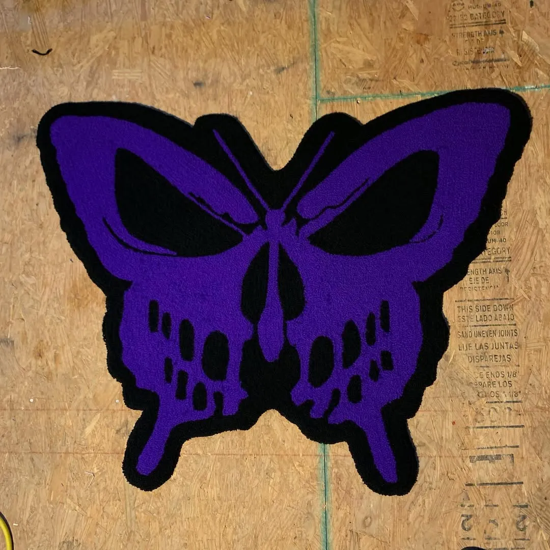 Unique wool rug with purple butterfly and skull pattern