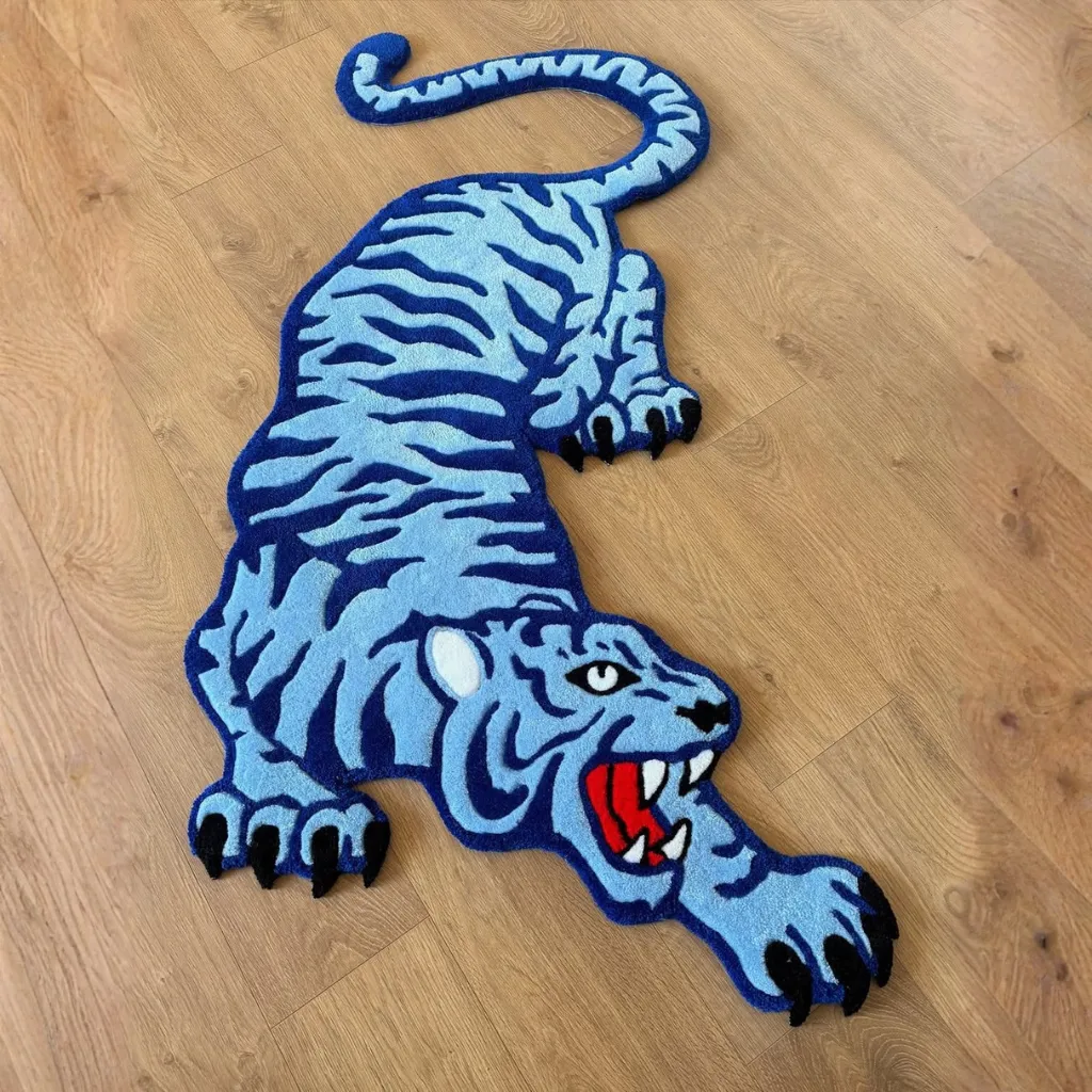Cool Fang Traditional Tattoo Style Tiger Rug Top down view of the Cool Fang Inked rug showing the full shape of the crawling blue tiger with black stripes.