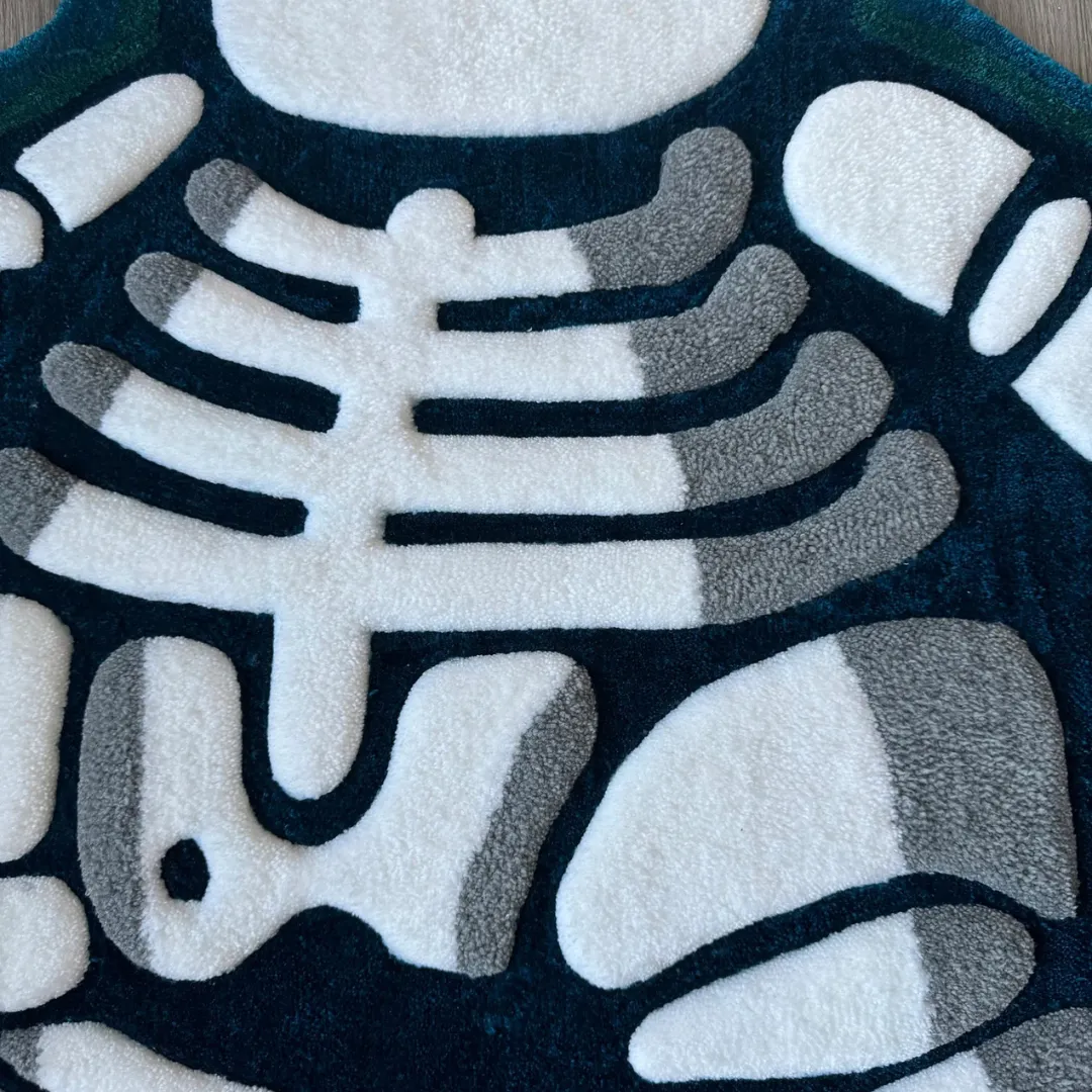 lazy lax rug white bone texture Close-up macro shot of the Lazy Lax rug showing the high-quality tufted wool texture and precise carving of the white skeletal design.