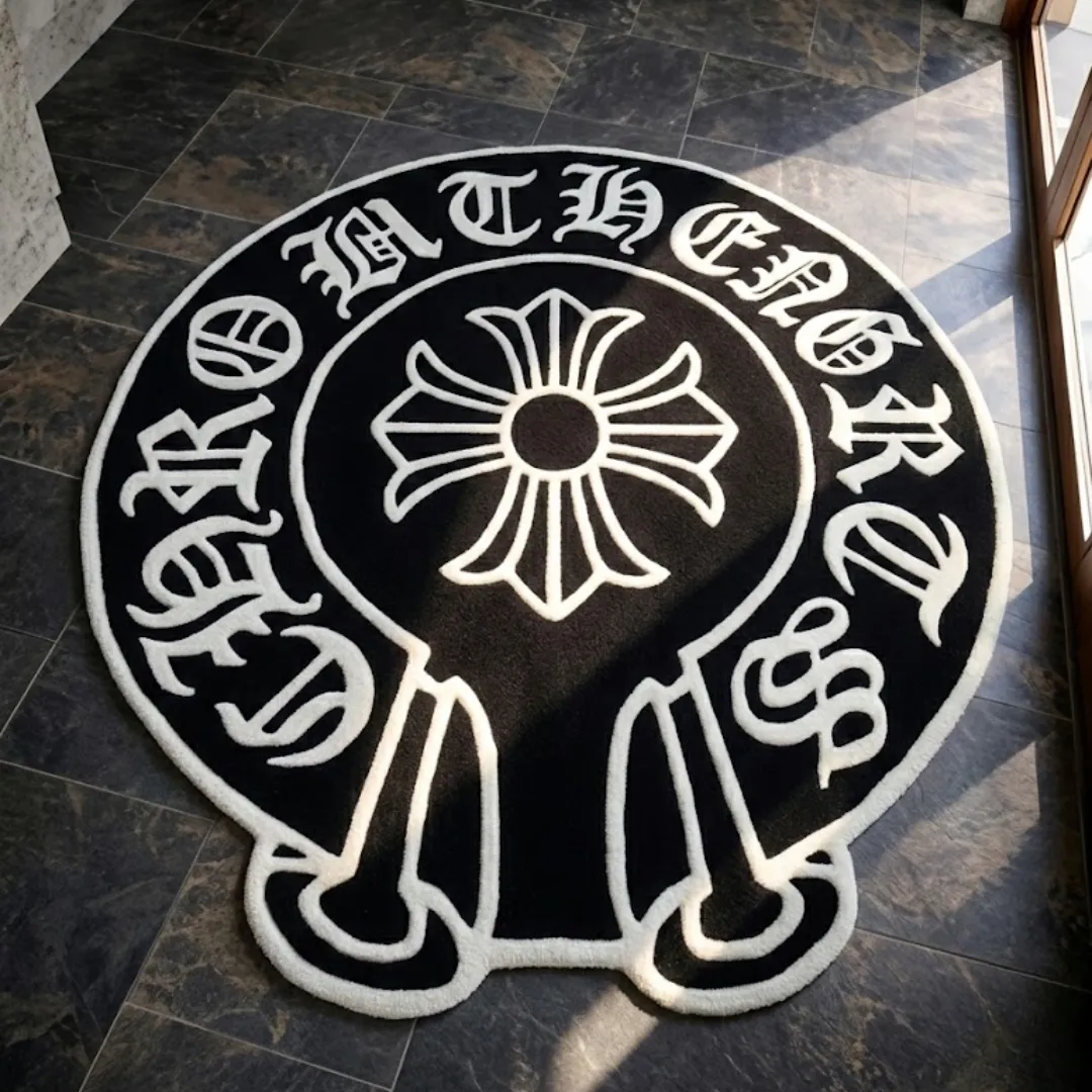 midnight noir crest rug lifestyle Perspective lifestyle view of the Midnight Noir Crest rug placed on a dark tile floor in a sunlit room, showcasing its circular shape with extended bottom details and the bold black and white streetwear-inspired design.