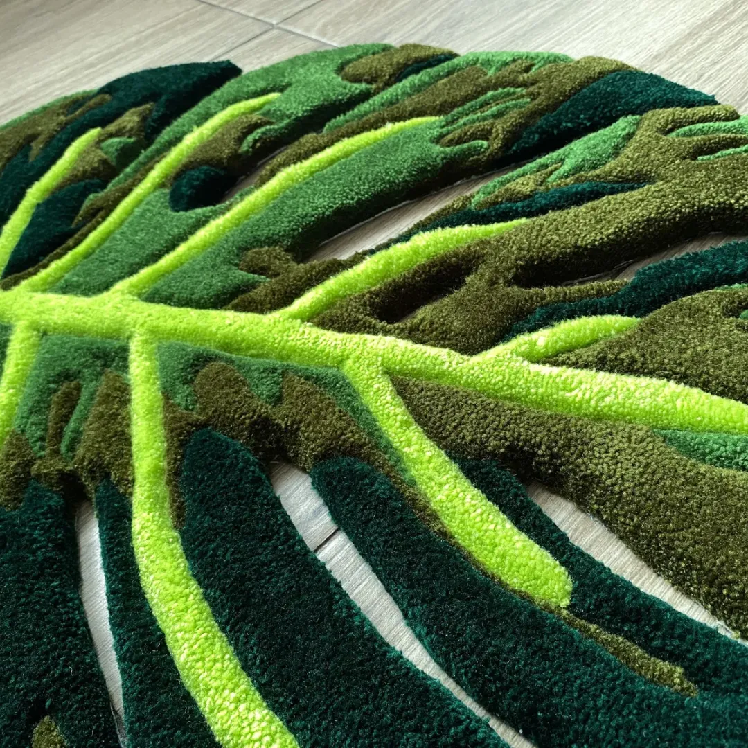 monstera flux rug close up texture A close-up detail of the Monstera Flux Rug, highlighting the thick tufted yarn texture, bright lime green leaf veins, and deep green contrasting shadows.