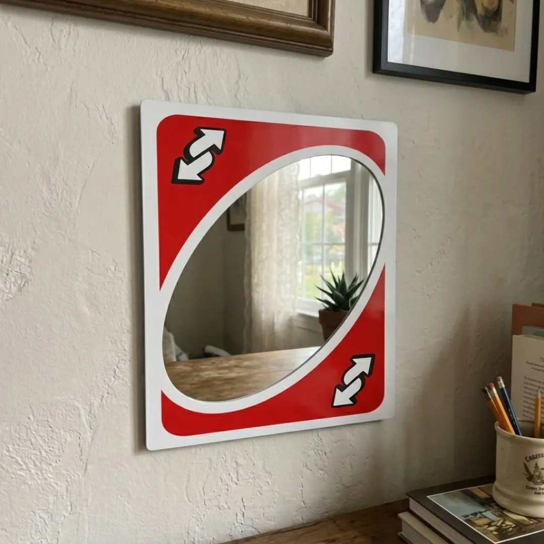 flip frame reverse card mirror lifestyle desk setting Lifestyle shot of the Flip Frame mirror mounted on a white wall above a desk, reflecting a window with a succulent, styled with books and pencils.