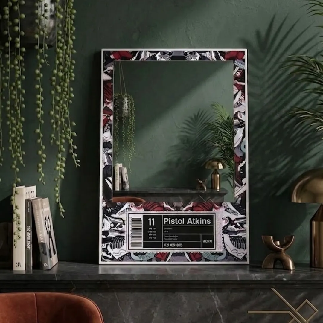 label kicks sneakerhead mirror dark aesthetic decor A vertical mirror featuring a custom "Pistol Atkins" sneaker-themed graphic border on a dark green mantle, surrounded by books and hanging ivy, reflecting a warm lamp and modern room interior.