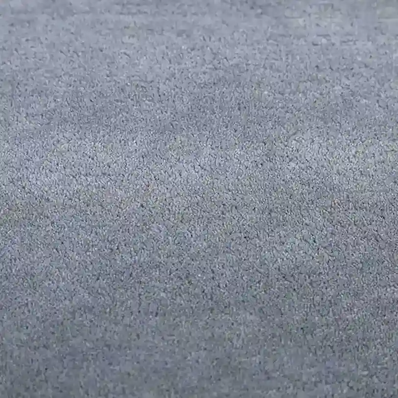 Smoky Wool Solid Gray Area Rug in modern living room setting