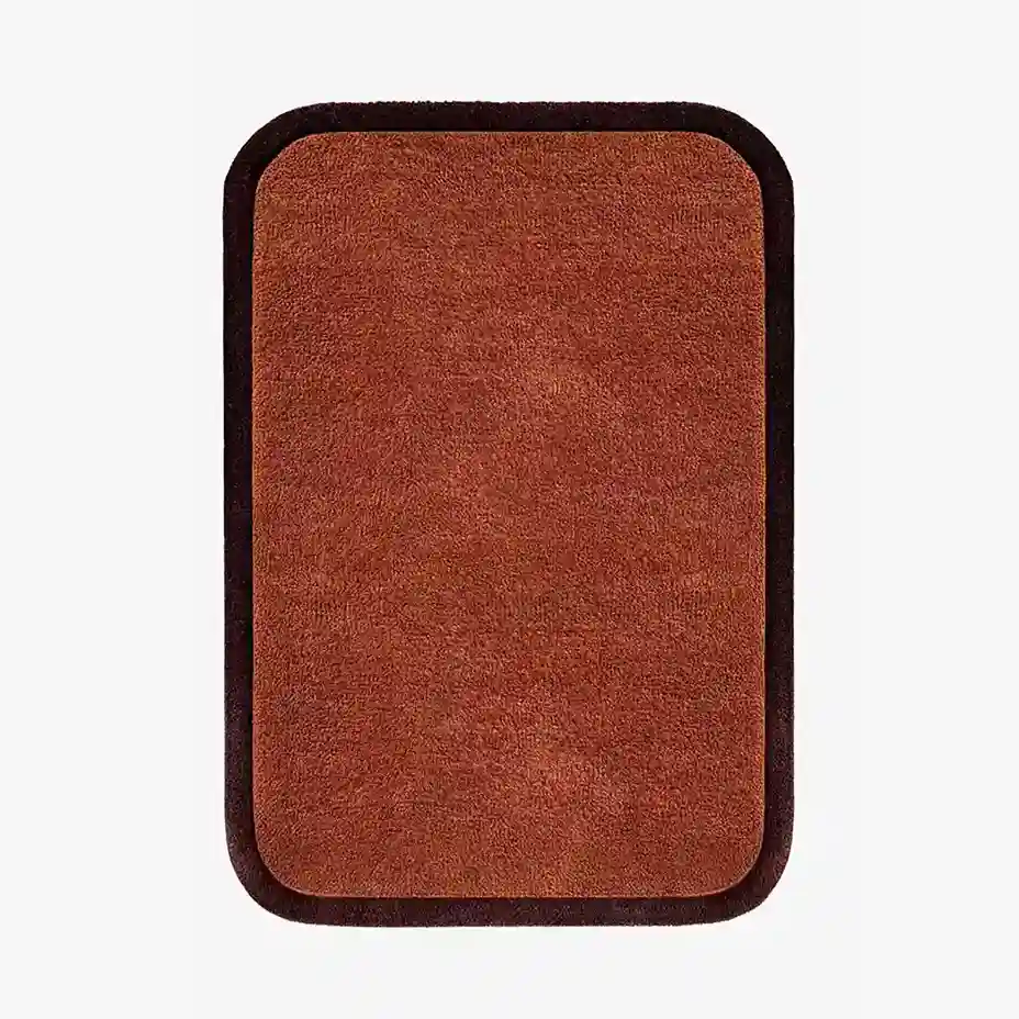 Solid Rust Border Hand Tufted Rug made from premium New Zealand wool, featuring a sleek black border and rich rust color