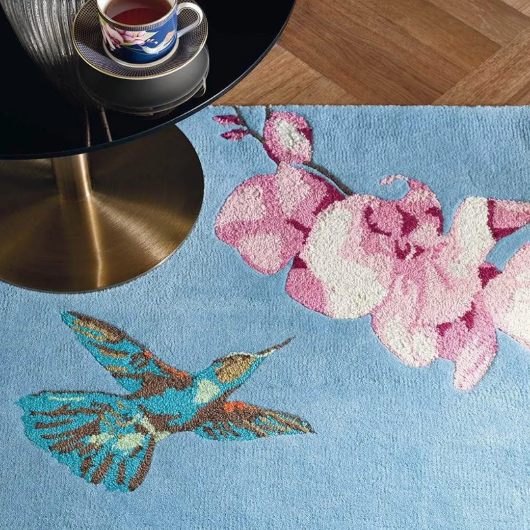 Sky-blue botanical rug with butterflies and birds