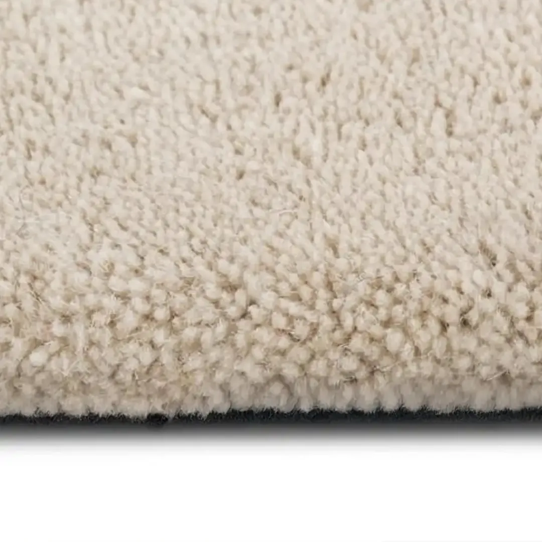 Bold checkered rug with soft cut-pile texture under natural light