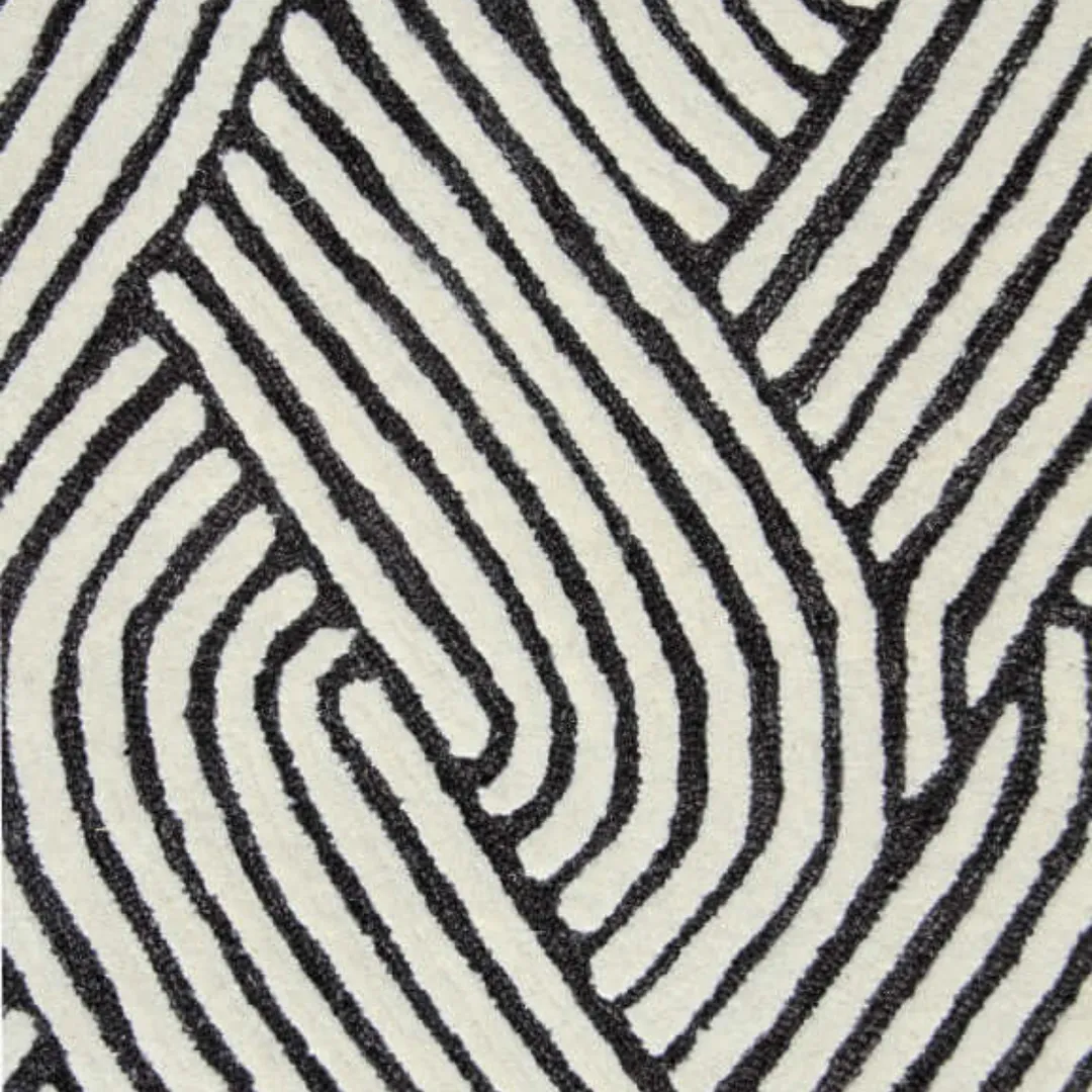 Close-up of braid-inspired black and white rug pattern