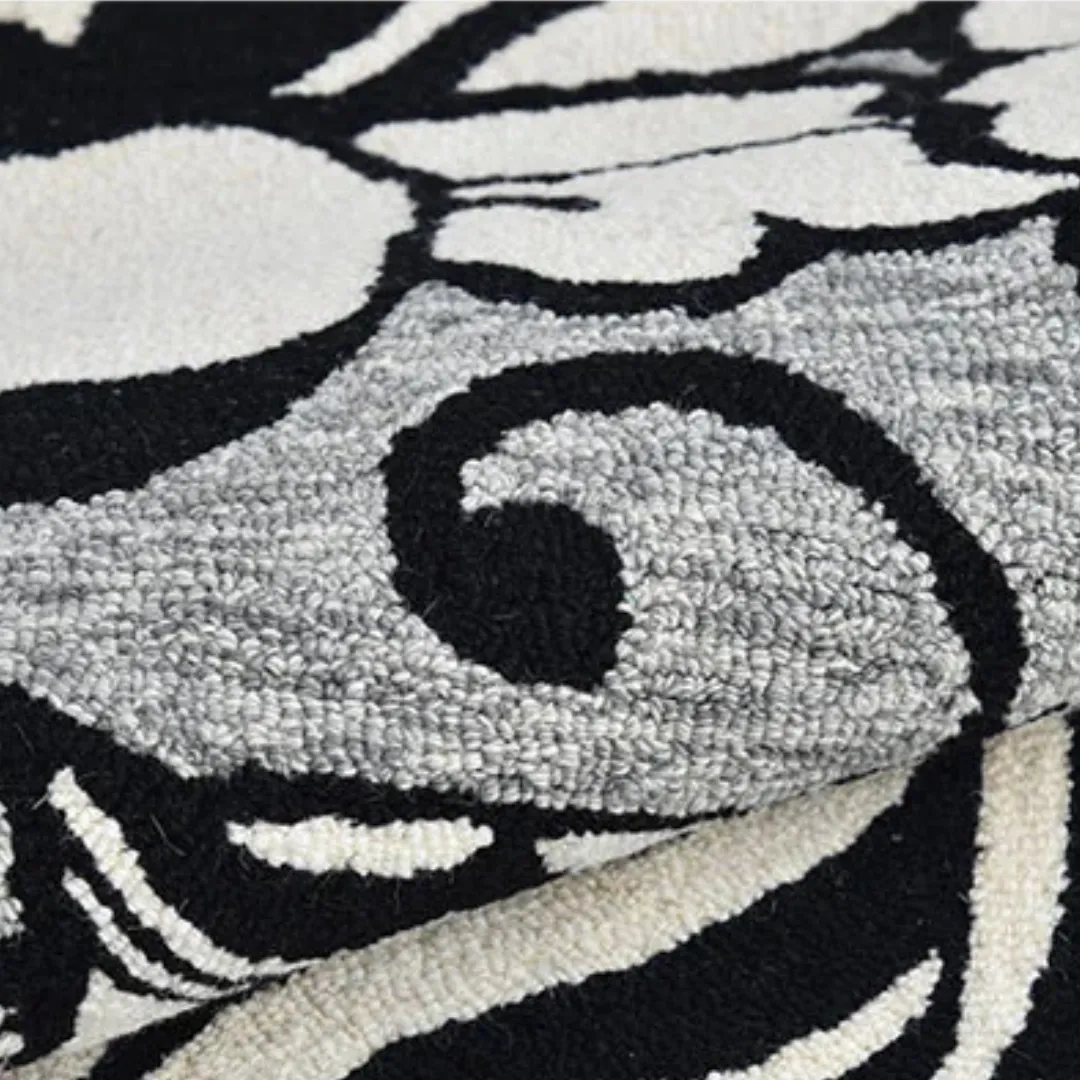 Modern area rug with black tropics design in living room