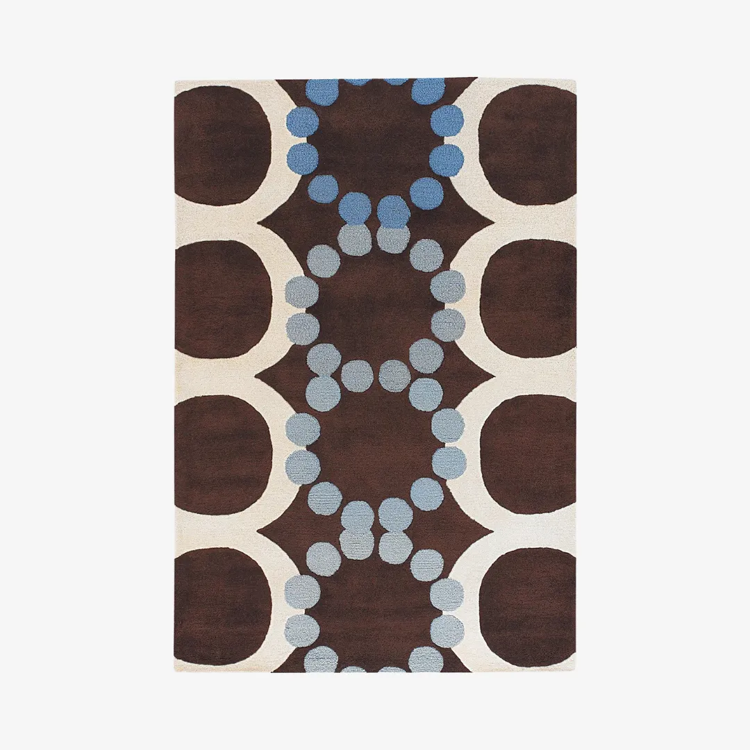Blue Dot Orbit area rug with brown field and playful dot pattern