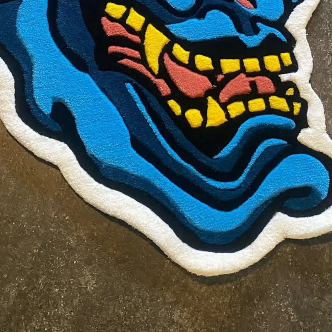 Close-up of Blue Hannya Mask Rug texture and bold colors