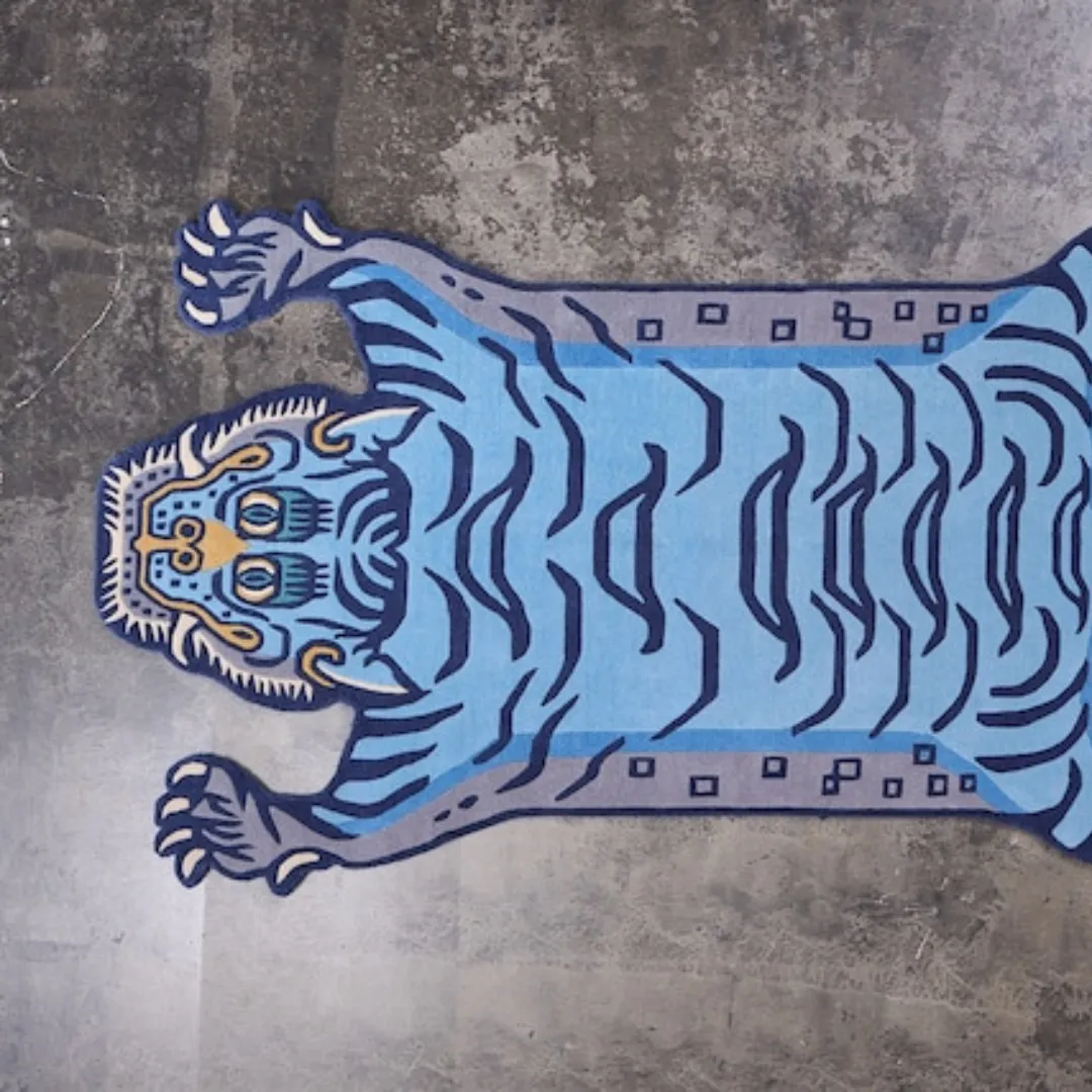 Hand-tufted tiger print rug in navy and gold