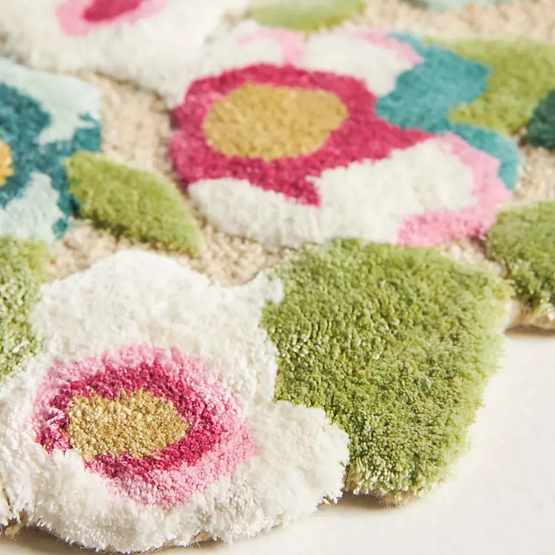 Close-up of hand-tufted wool texture and colorful floral pattern