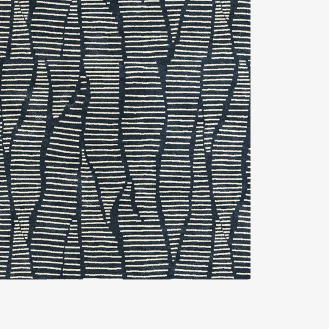 Blue and beige abstract pattern rug in living room