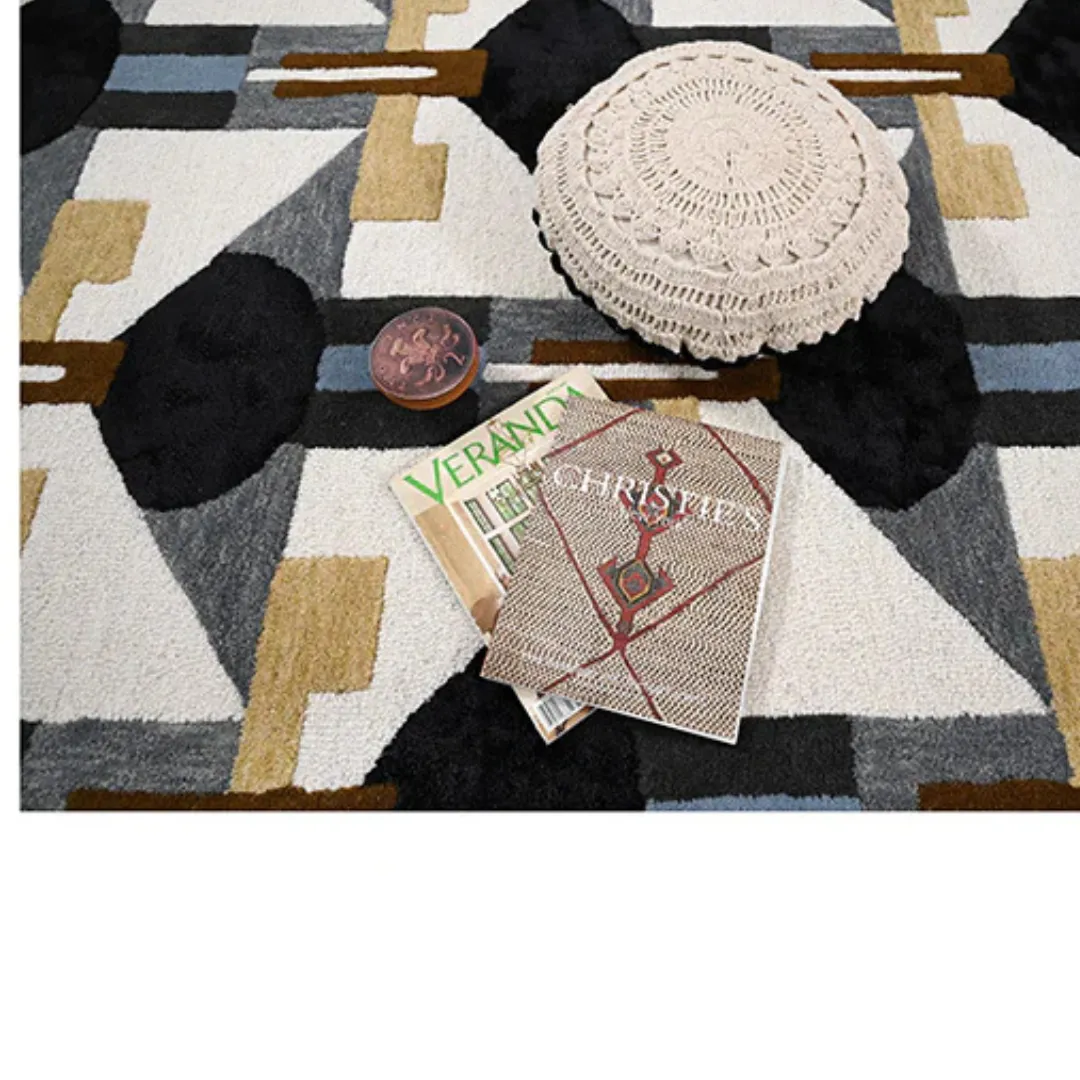 Hand-tufted geometric wool area rug styled in living room