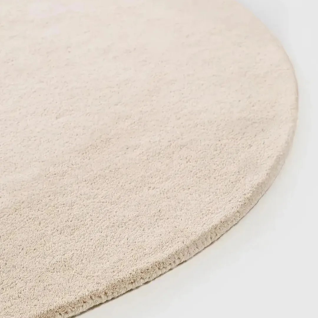 Modern round rug with split black and white design