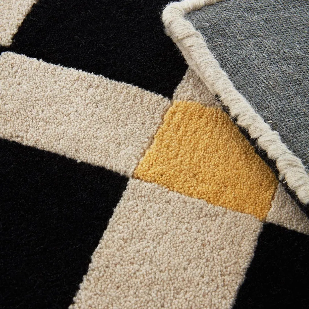 Close-up of hand-tufted wool and silk in checkered pattern