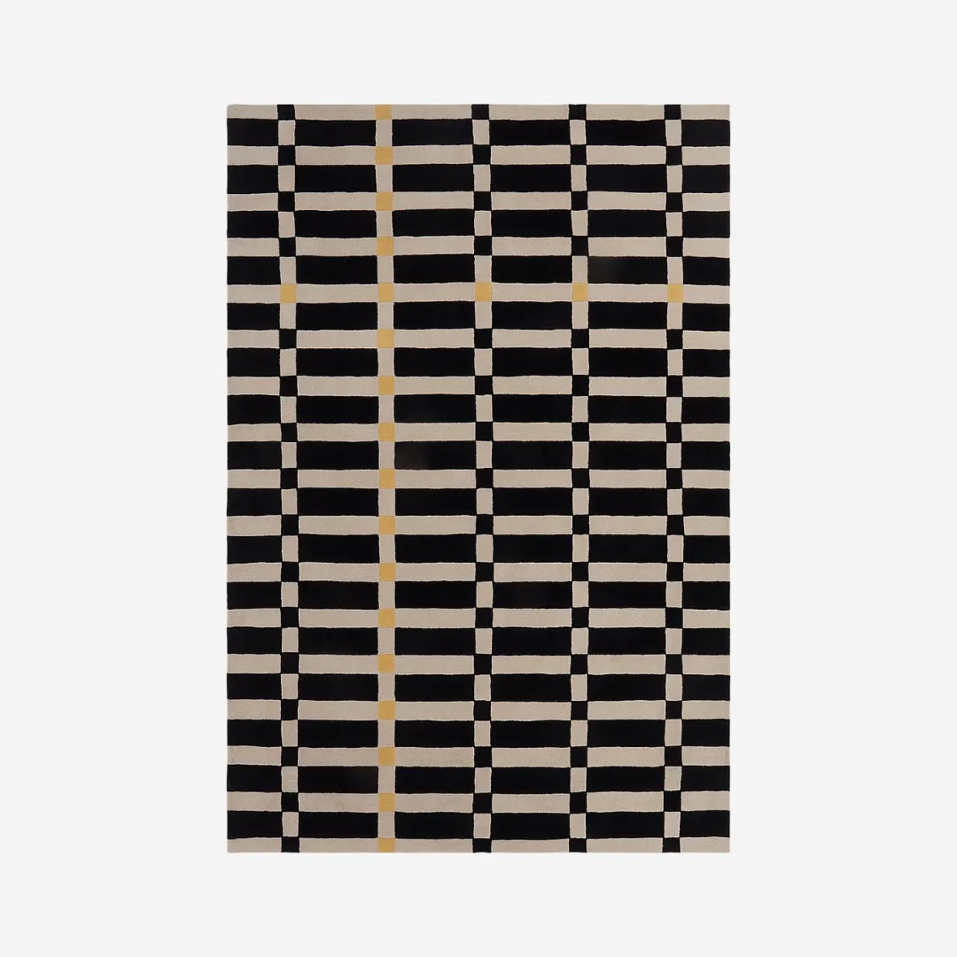 Modern checkered beige rug with black grid and yellow accent line