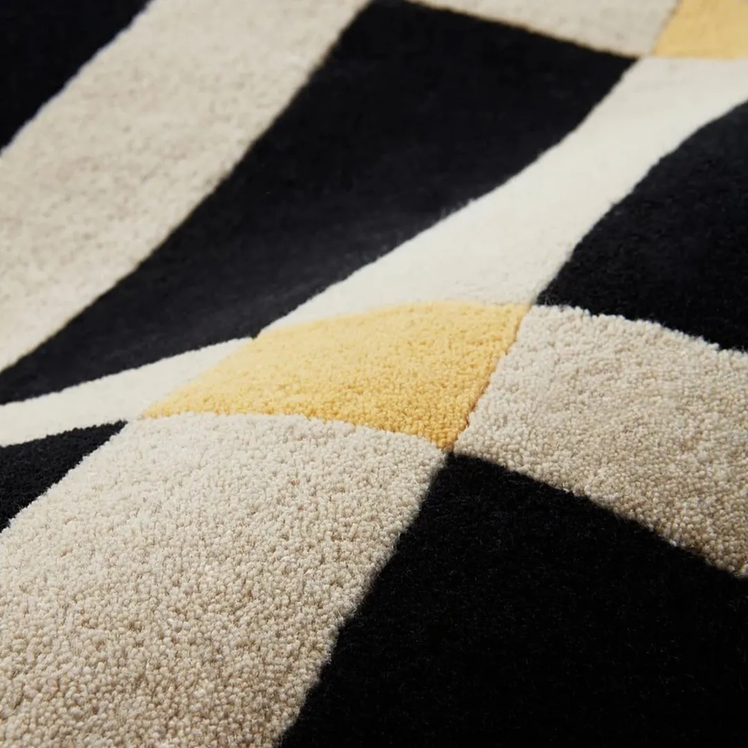 Modern living or dining room with checkered beige area rug