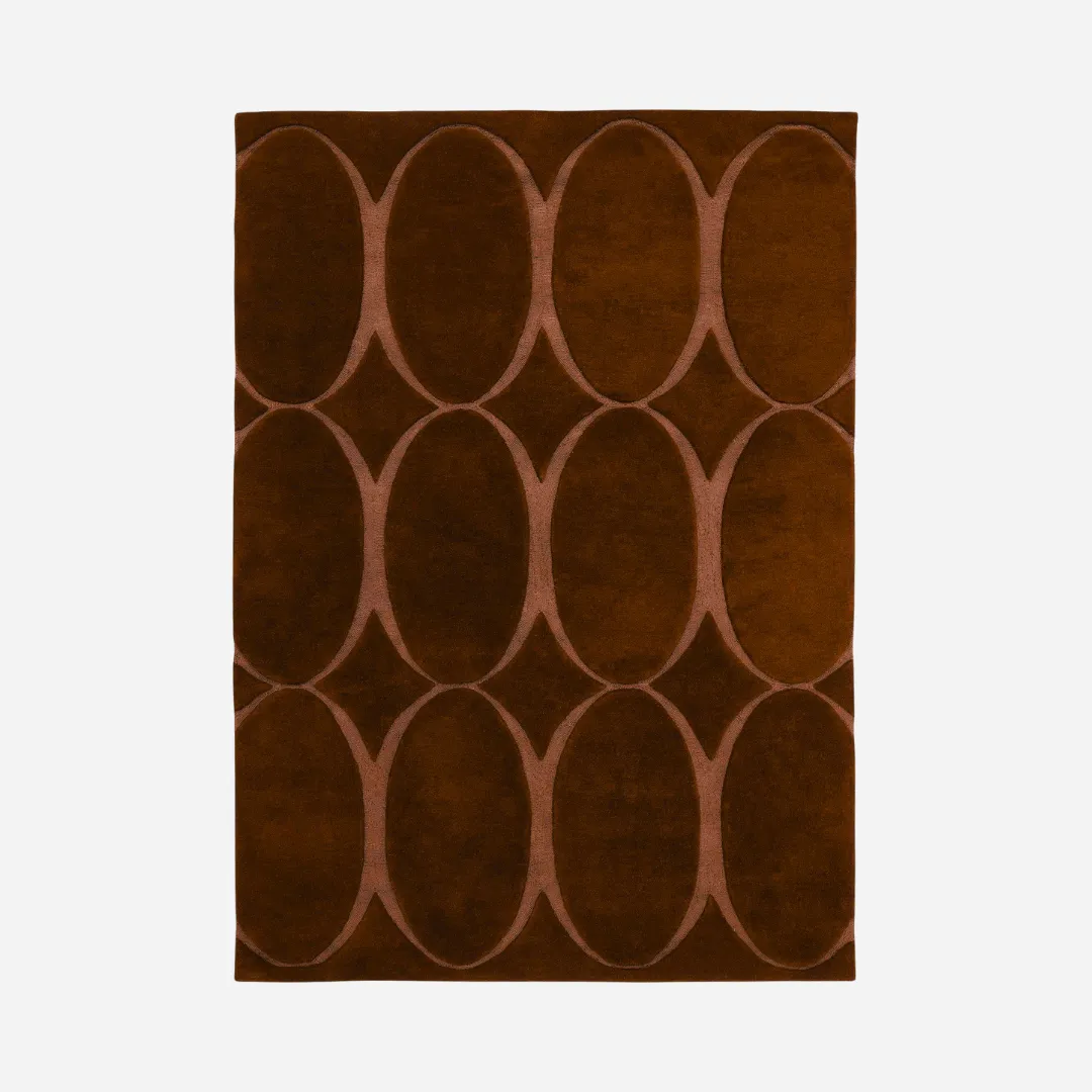 Hand-tufted orange rug with oval eclipse design