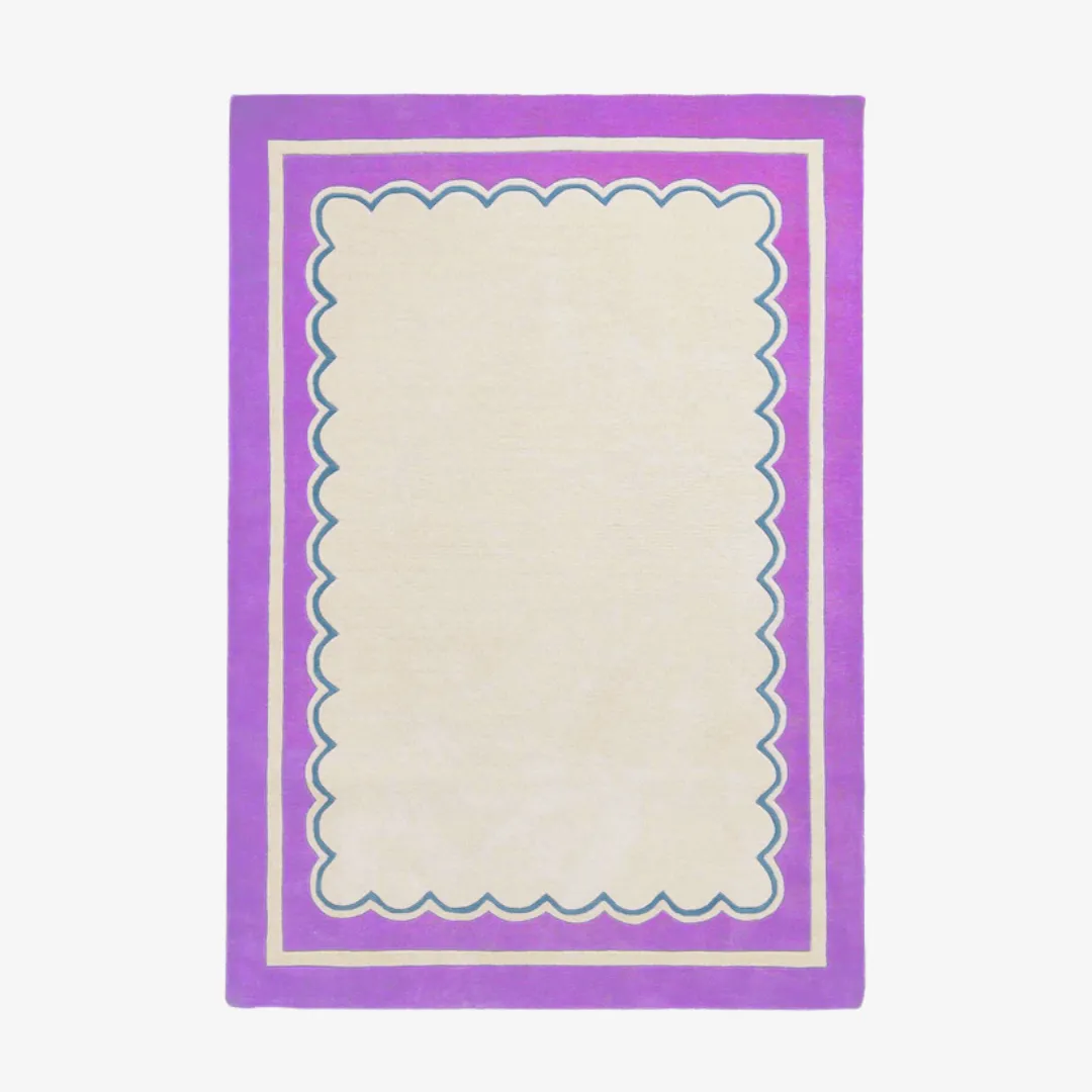Purple scallop border rug with cream center and soft blue trim