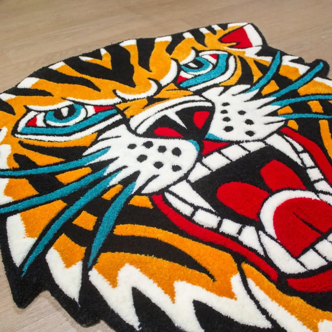 Bright orange tiger rug with teal whiskers and red mouth