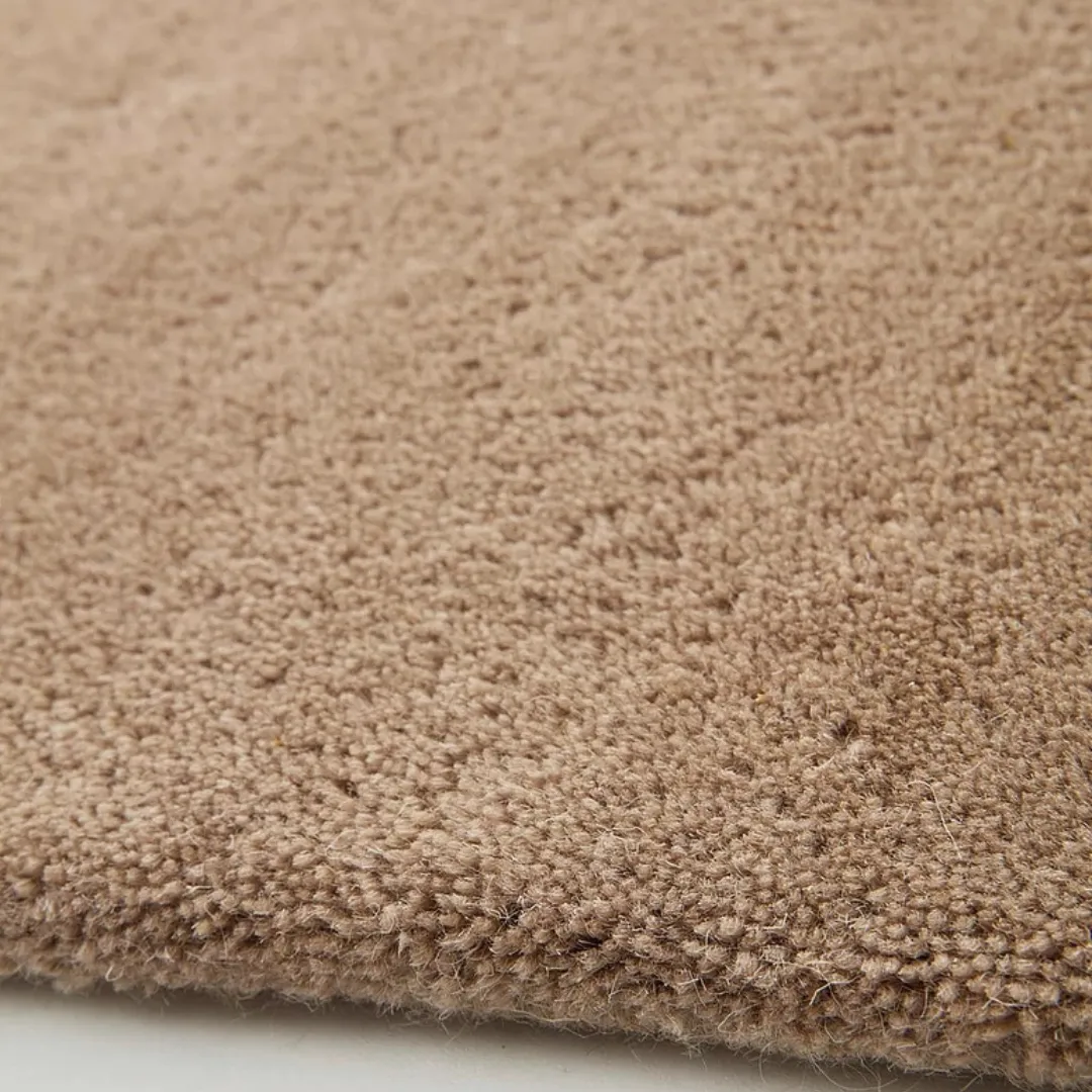 Warm brown rug in a cozy modern bedroom