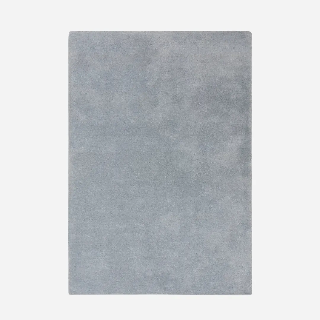 Solid gray area rug with soft hand-tufted texture