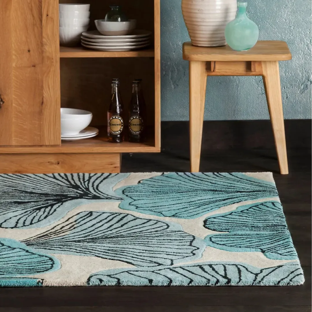 Teal botanical rug in a bright modern bedroom or living room