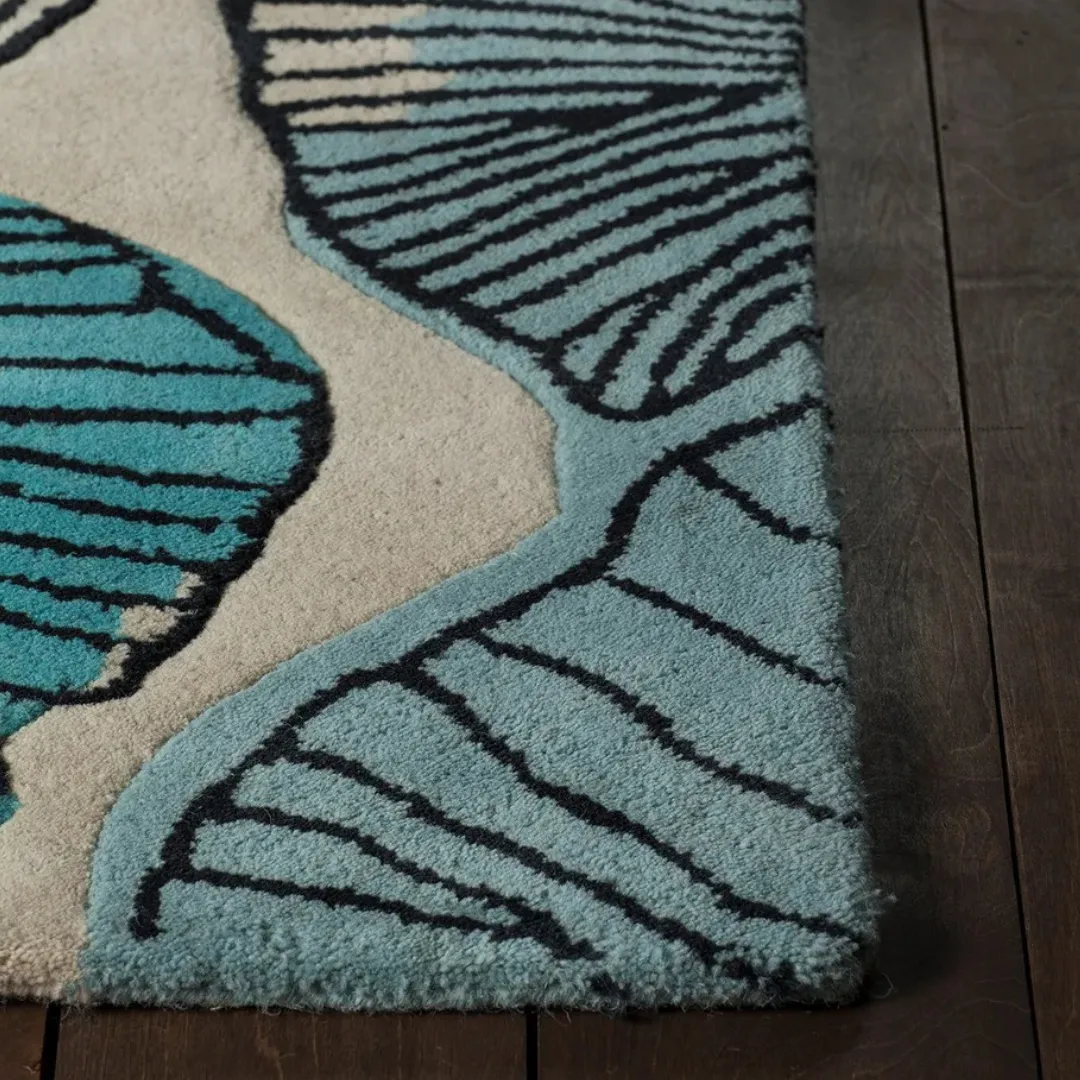 Side view of rug showing thickness and hand-tufted texture