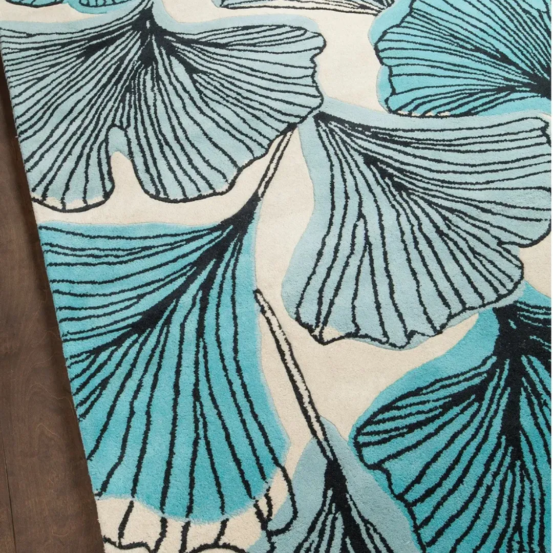 Full rug layout showing ginkgo leaves in teal and aqua tones