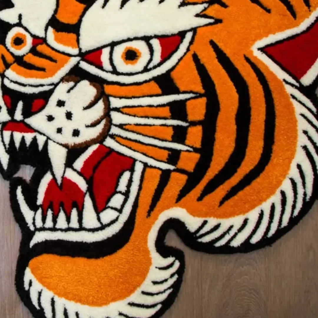 Fierce tiger face rug in vintage tattoo style, handcrafted with orange and black tufted texture.