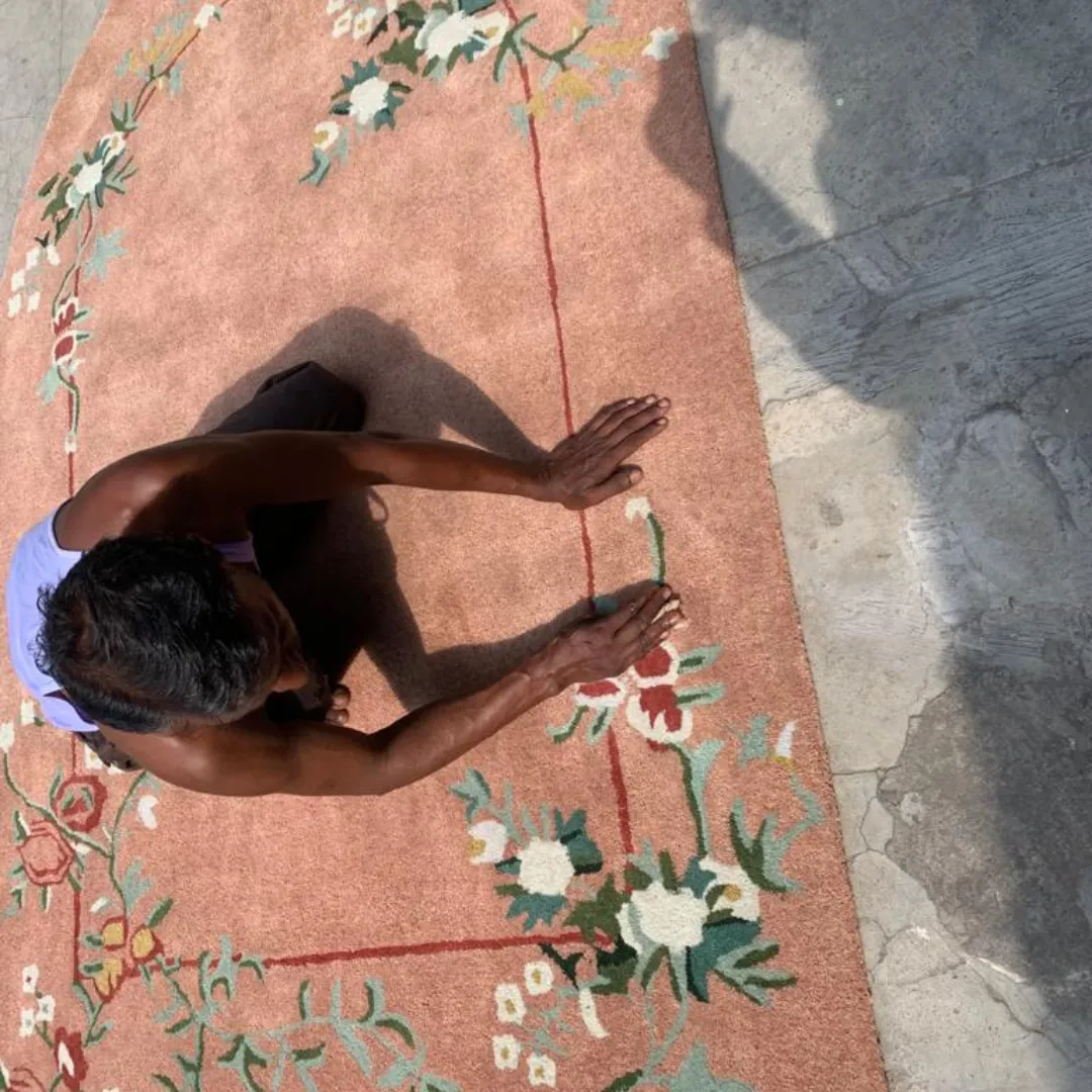 Stylish wool rug with pink, red, and green flowers