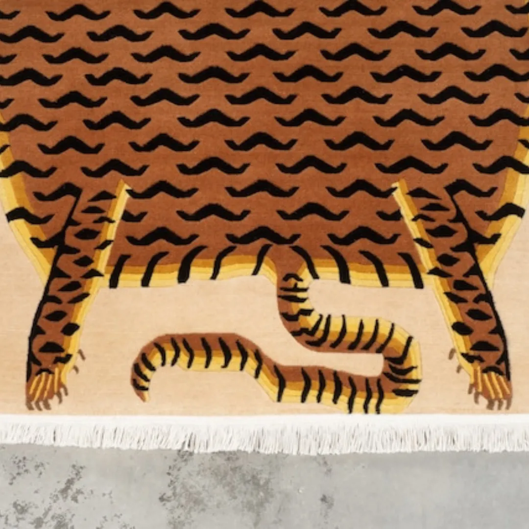 Flatweave tiger skin rug with traditional Tibetan design