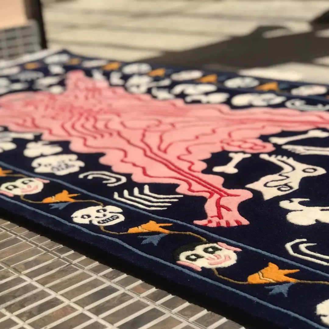 Detailed view of hand-tufted demon tattoo rug with cryptic symbols