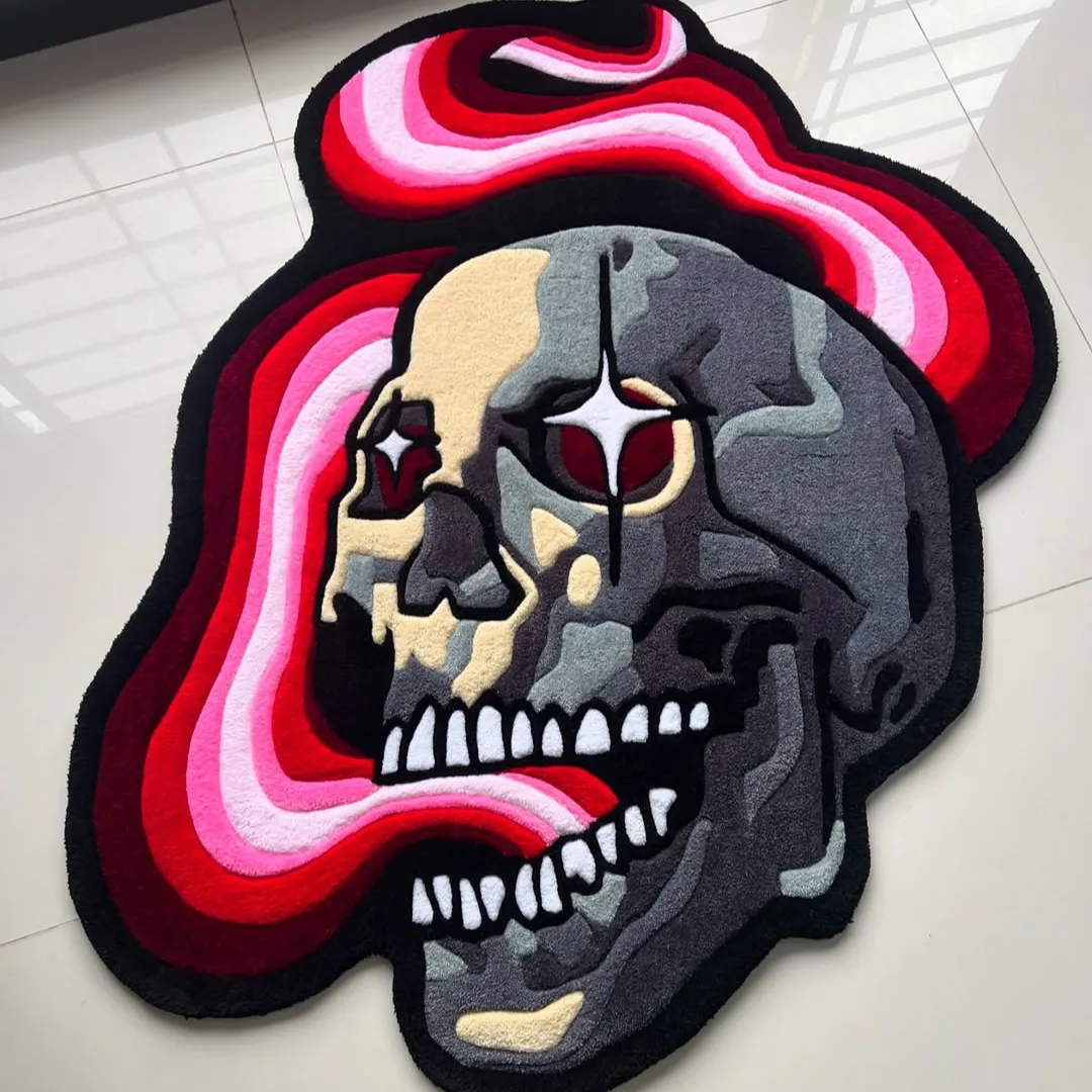 Psychedelic skull-shaped tattoo rug with red eyes, camo shading, and a swirling red-pink tongue design.