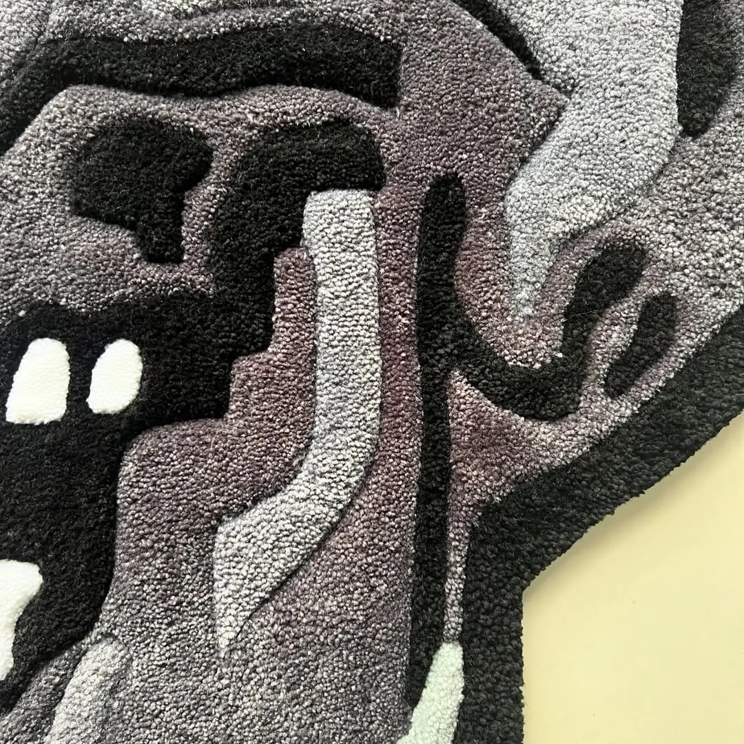 Skull-shaped rug with red eyes, camo shading, and a swirling red-pink tongue design.