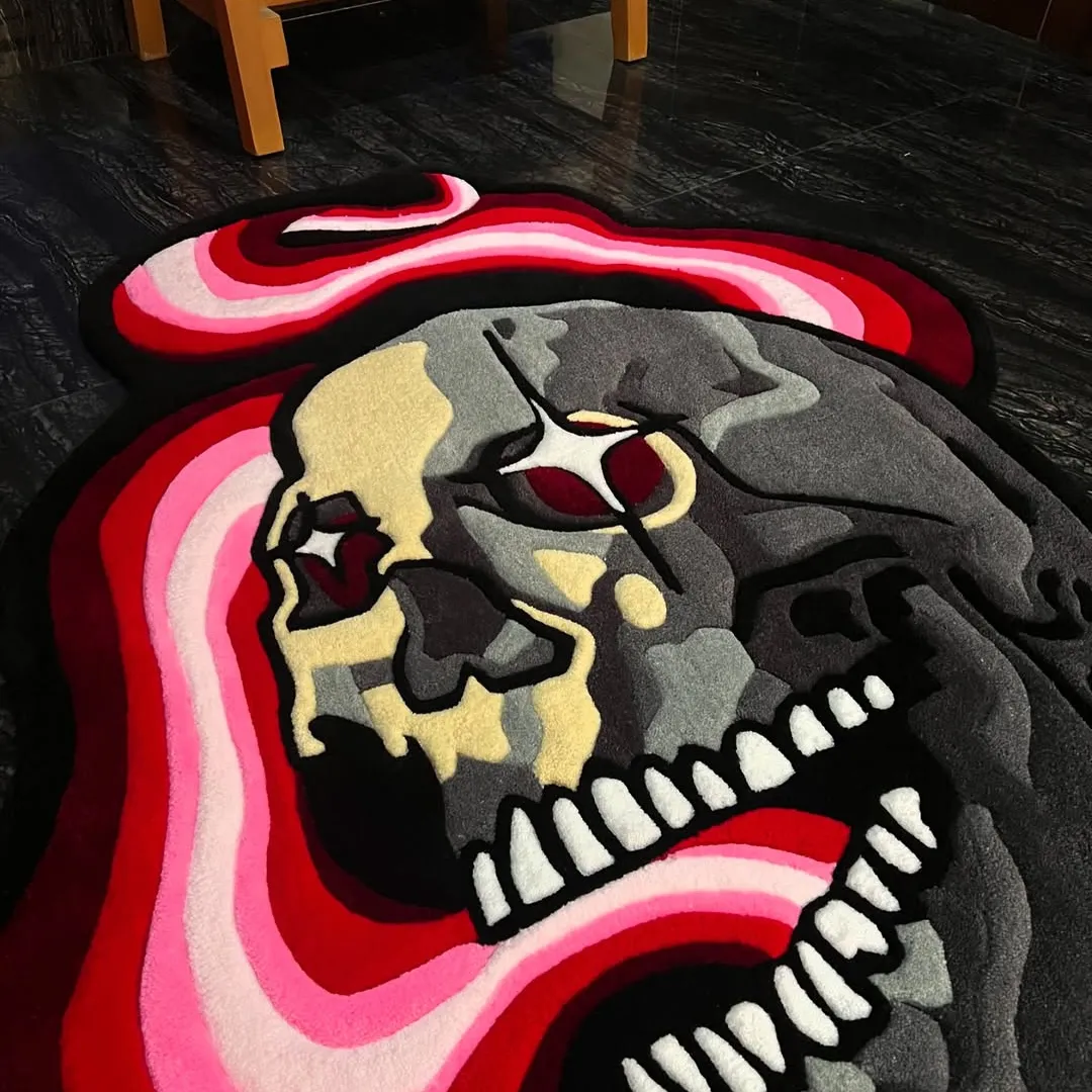 Hand tufted Psychedelic skull-shaped rug with red eyes, camo shading, and a swirling red-pink tongue design.