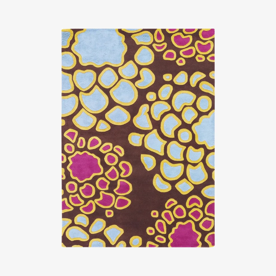 Floral hand-tufted rug with pink, yellow, and blue design