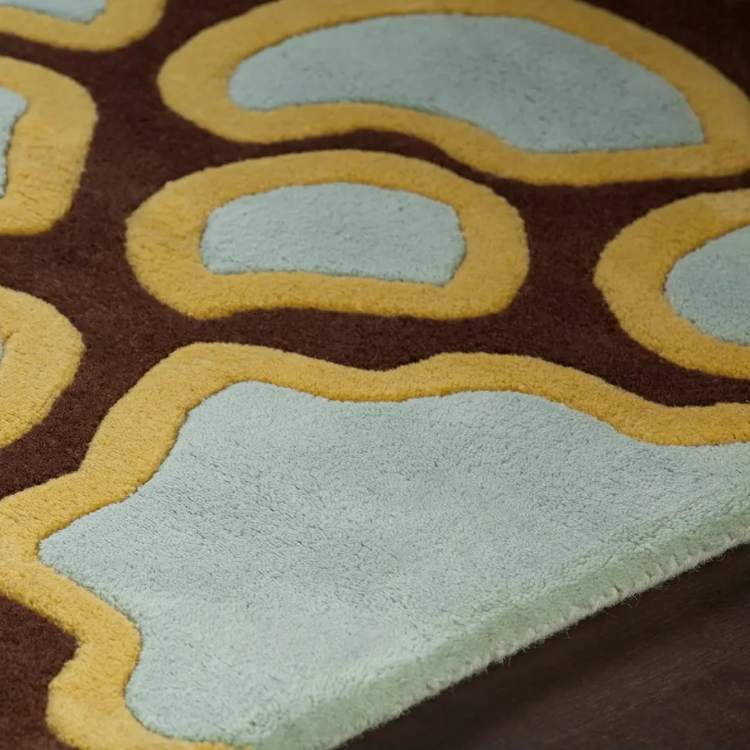 Colorful hand-tufted rug with bold floral pattern