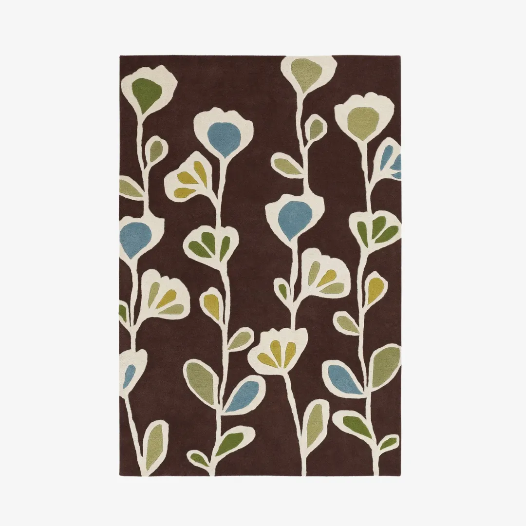 Floral hand-tufted rug with blue, green, and yellow flowers