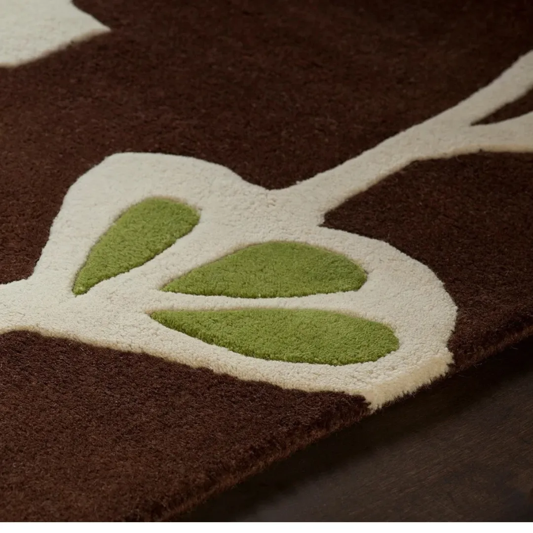 Soft wool rug with floral design on brown background