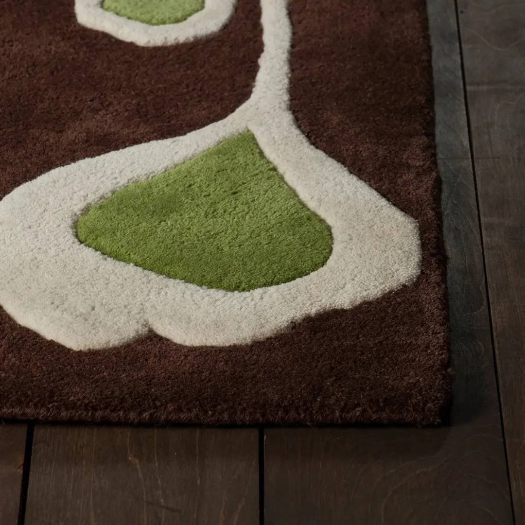 Vibrant flower pattern rug in blue, green, and yellow