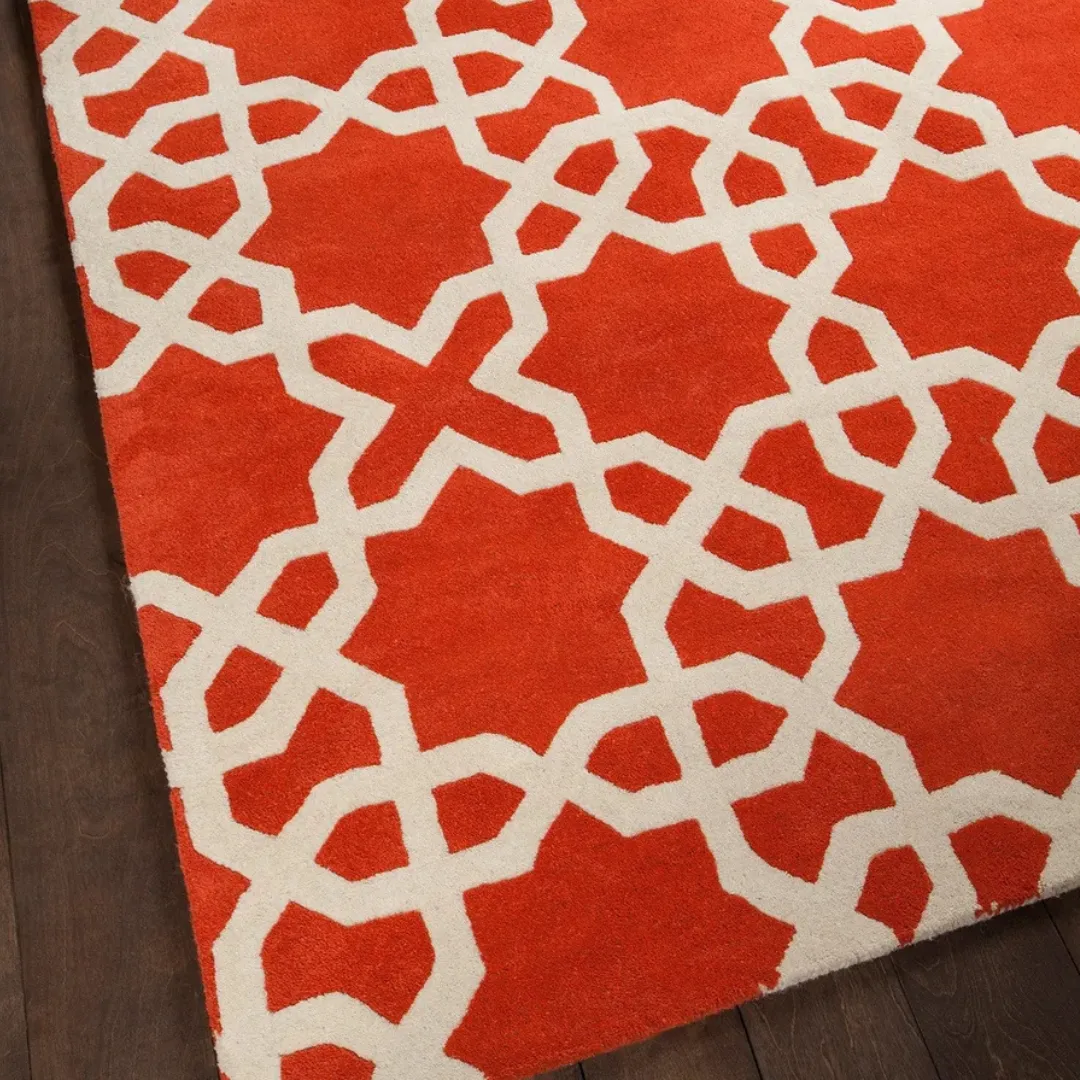 Bold geometric star pattern rug in red and white