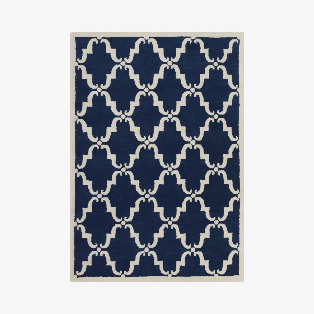 Nautical geometric area rug in navy and white tones