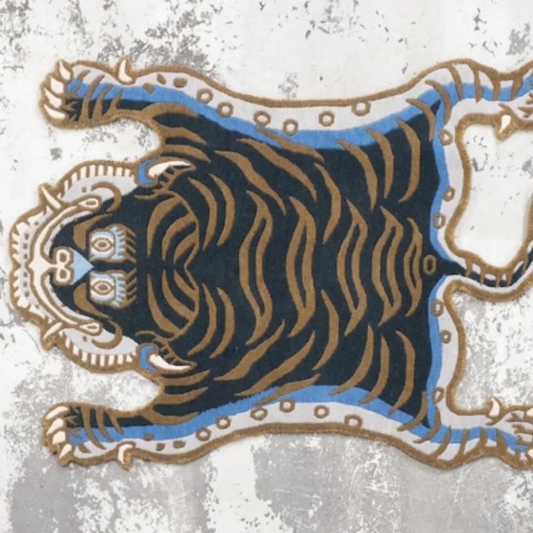 Fierce Tibetan tiger rug with blue accent edges