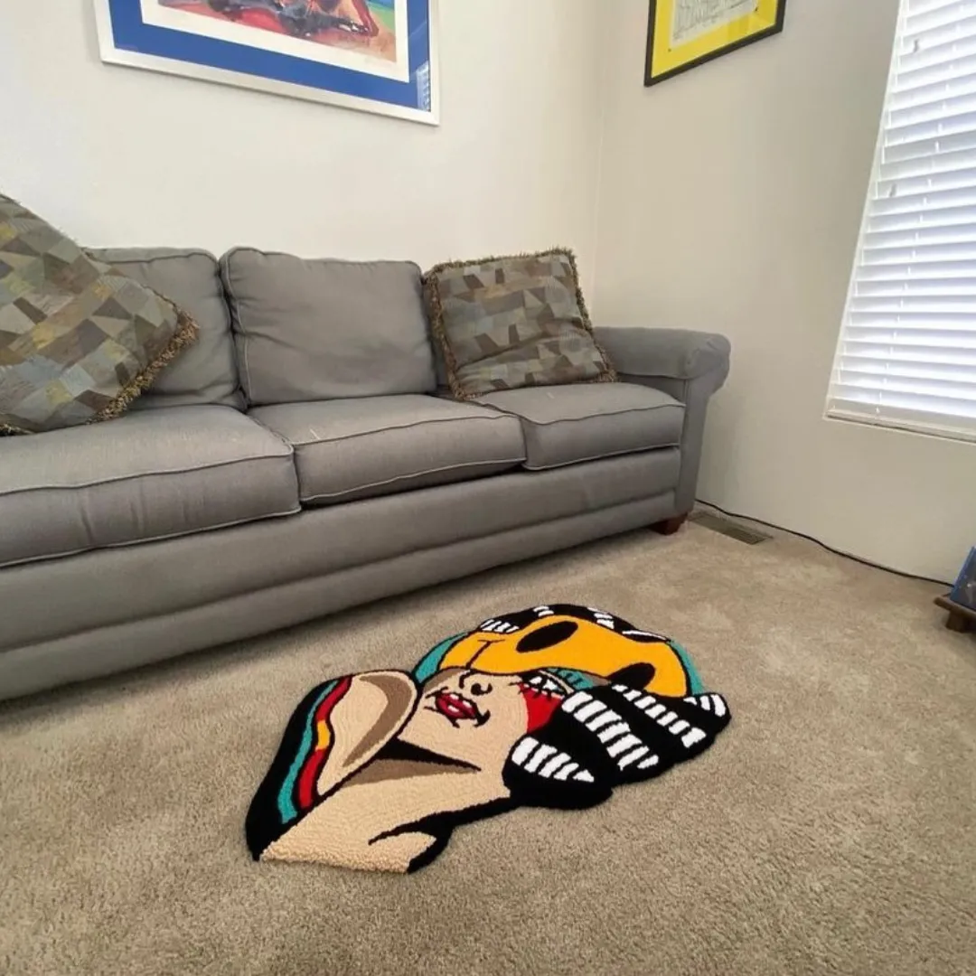 Custom-shaped rug of a pop-art girl wearing a yellow mask with bold red, black, and teal accent rug placed in living room.
